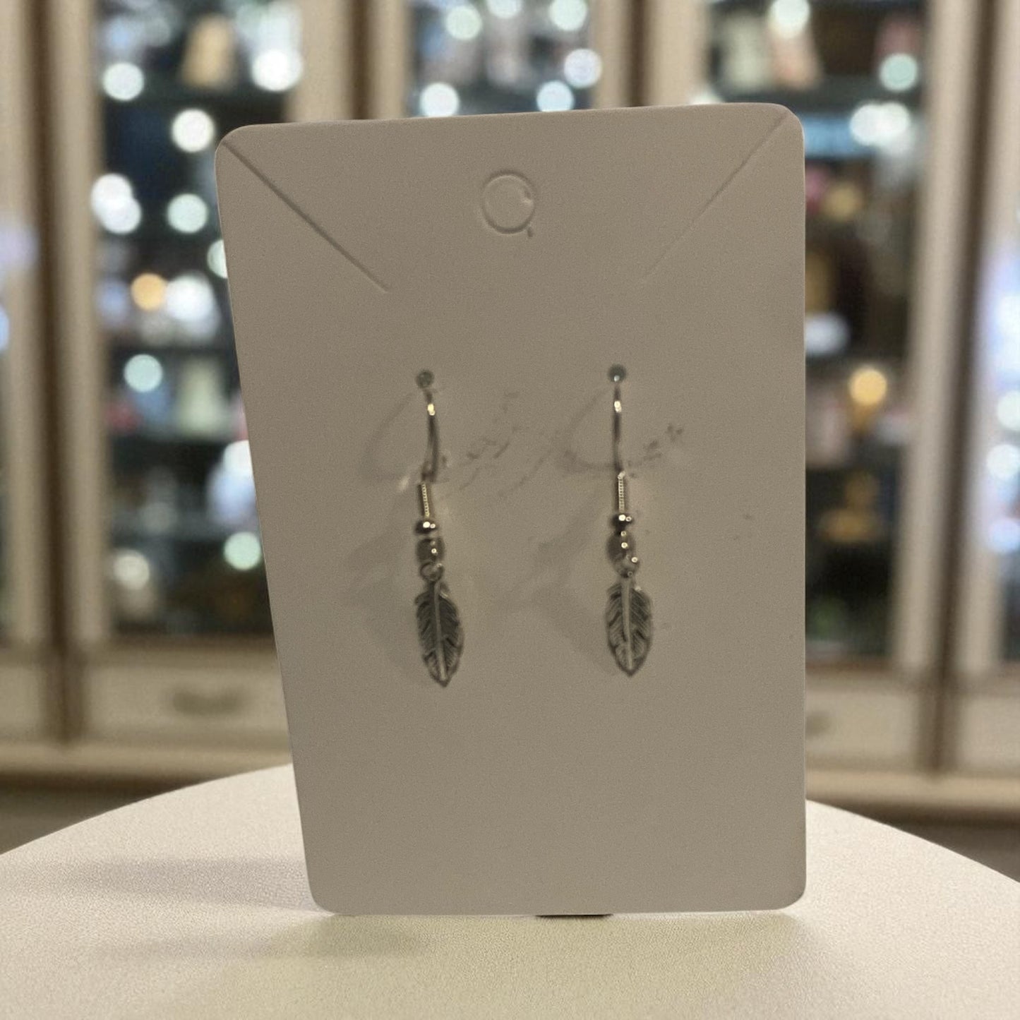 Silver feather earrings